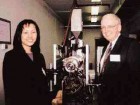 U of T Professor Steve Balke and graduate student Lianne Ing at the nozzle of Macro Engineering's glass extruder