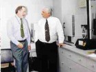 Keeping up with quality demands: (Left to right) President Ken Wasylyk and vice-president sales/marketing Don Stegmaier in Custom Medallion's new quality control lab.