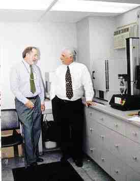 Keeping up with quality demands: (Left to right) President Ken Wasylyk and vice-president sales/marketing Don Stegmaier in Custom Medallion's new quality control lab.