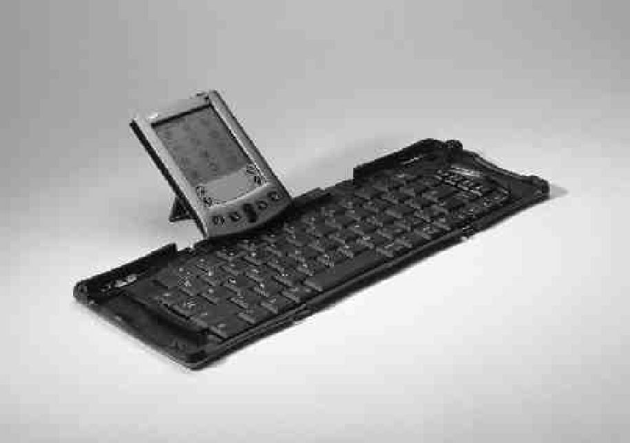 Think Outside, Inc.'s innovative design for a portable keyboard includes two double hinges whose inside holes are molded with a slide pin. Folded up, the keyboard fits in your palm; opened, it is a very flat, full-size keyboard.