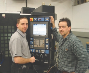 Dave Tomic, CNC manager, and Pete Florica on the shop floor.