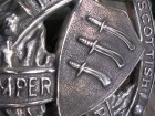 Close-up of the machined and polished Scottish Essex Regimental crest.
