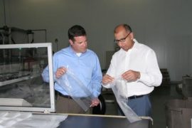 Polykar's David Andrews (left) and Amir Karim (right) examine gusseted bags.