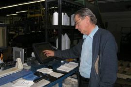 B&C Plastics president Cory Gambon, Sr. reviewing real-time production data.